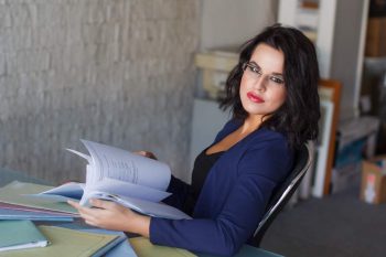 attractive woman reviewing her tax returns