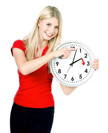 young lady moving hands on clock forward