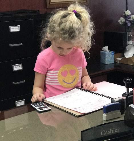 Greg's granddaughter working at the office
