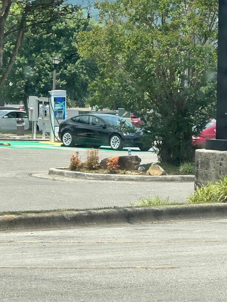 Tesla Charging at a public charger in Cullman
