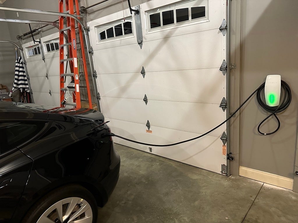 Tesla connected to wall mount charger