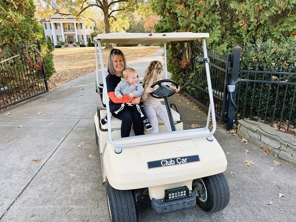 Kynzley driving the golf cart