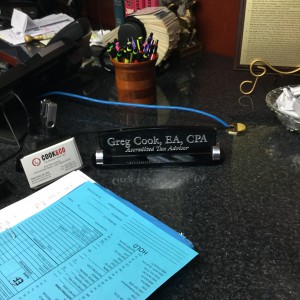 closeup of Greg's name plate on his desk