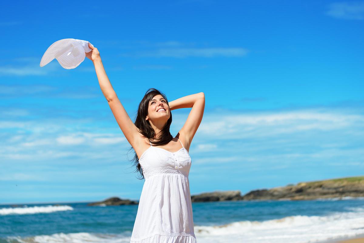 woman celebrating on beach