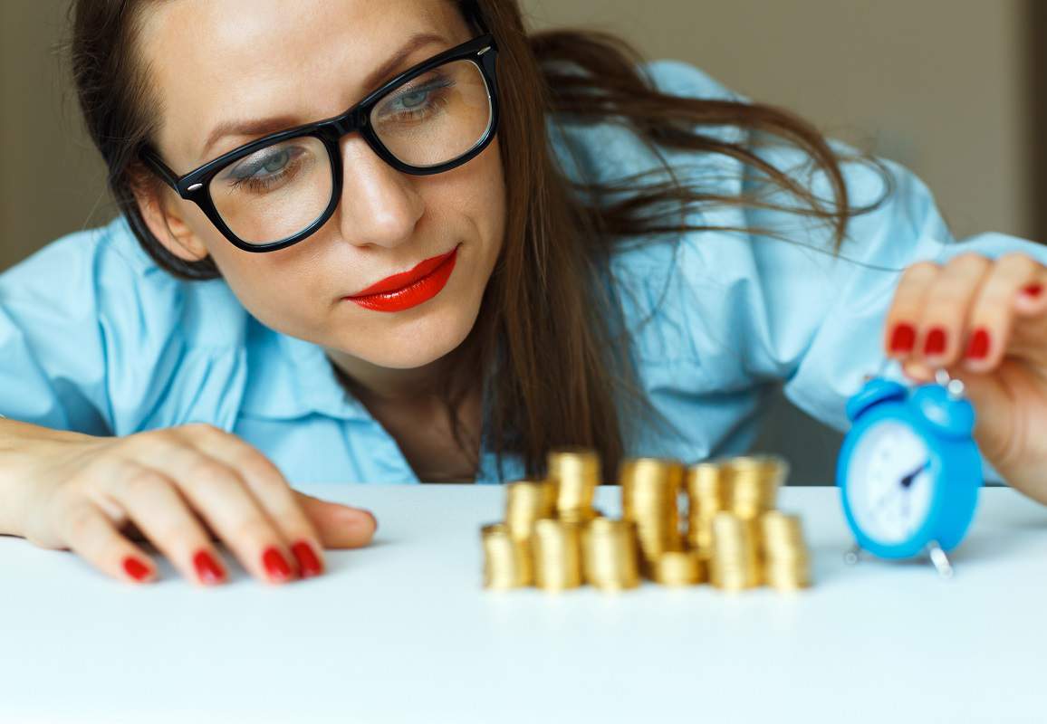 woman with money and a clock