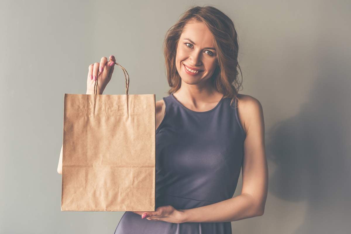 woman with brown paper bag