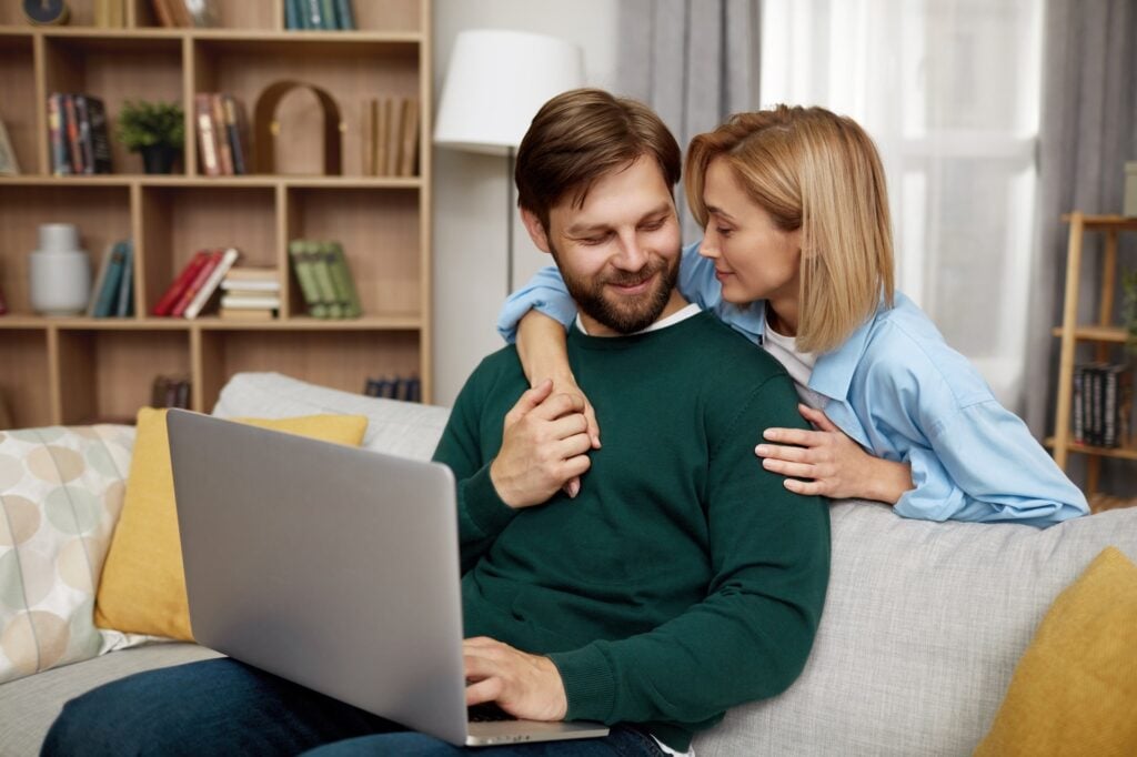 couple using laptop to access portal