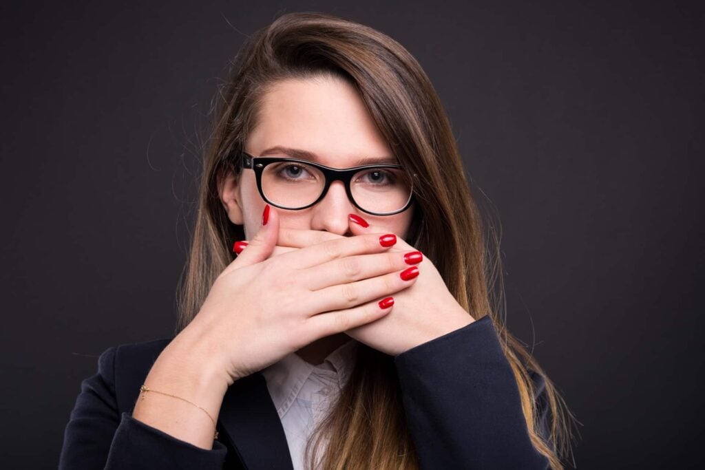 Girl manager covering her mouth with hands