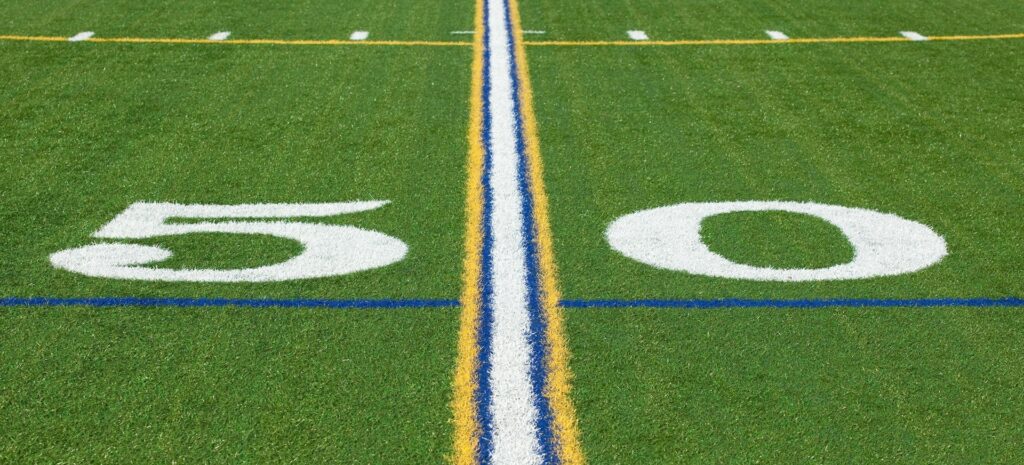 At the 50 yard line on a football field