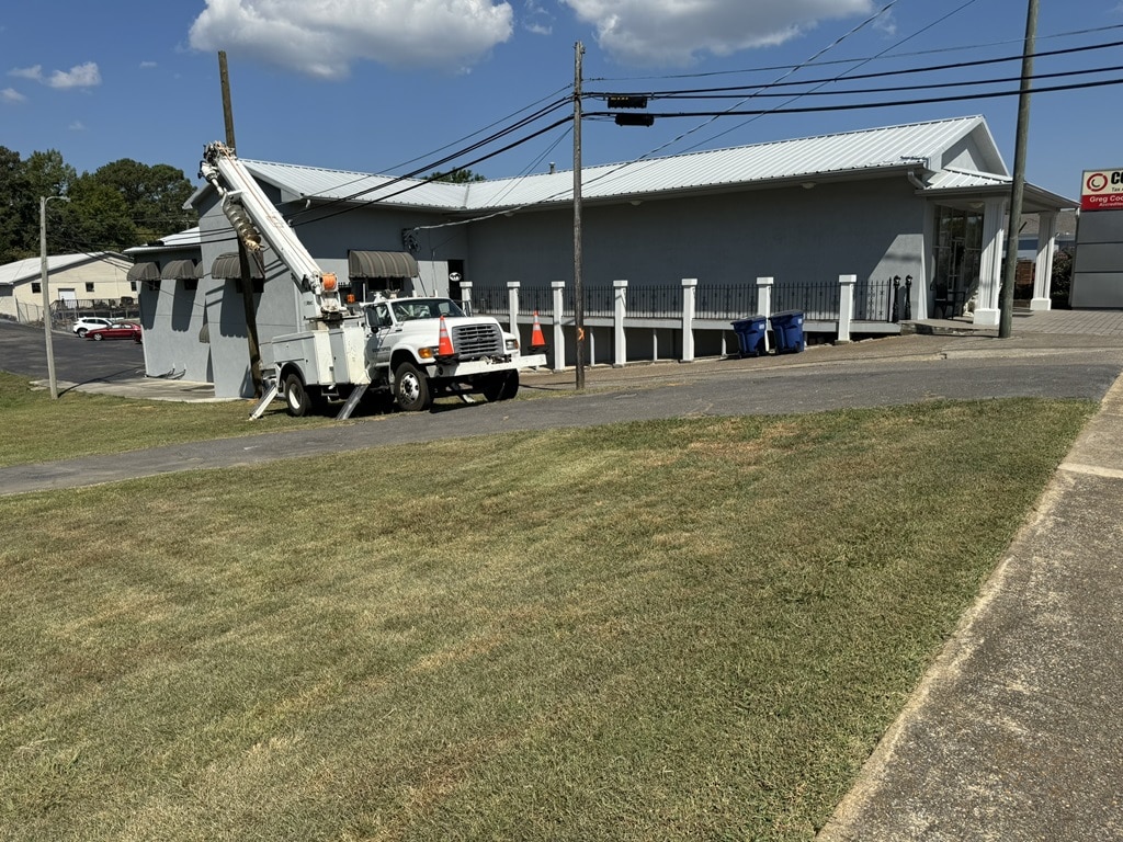 relocating and replacing telephone pole to make way for expanded parking